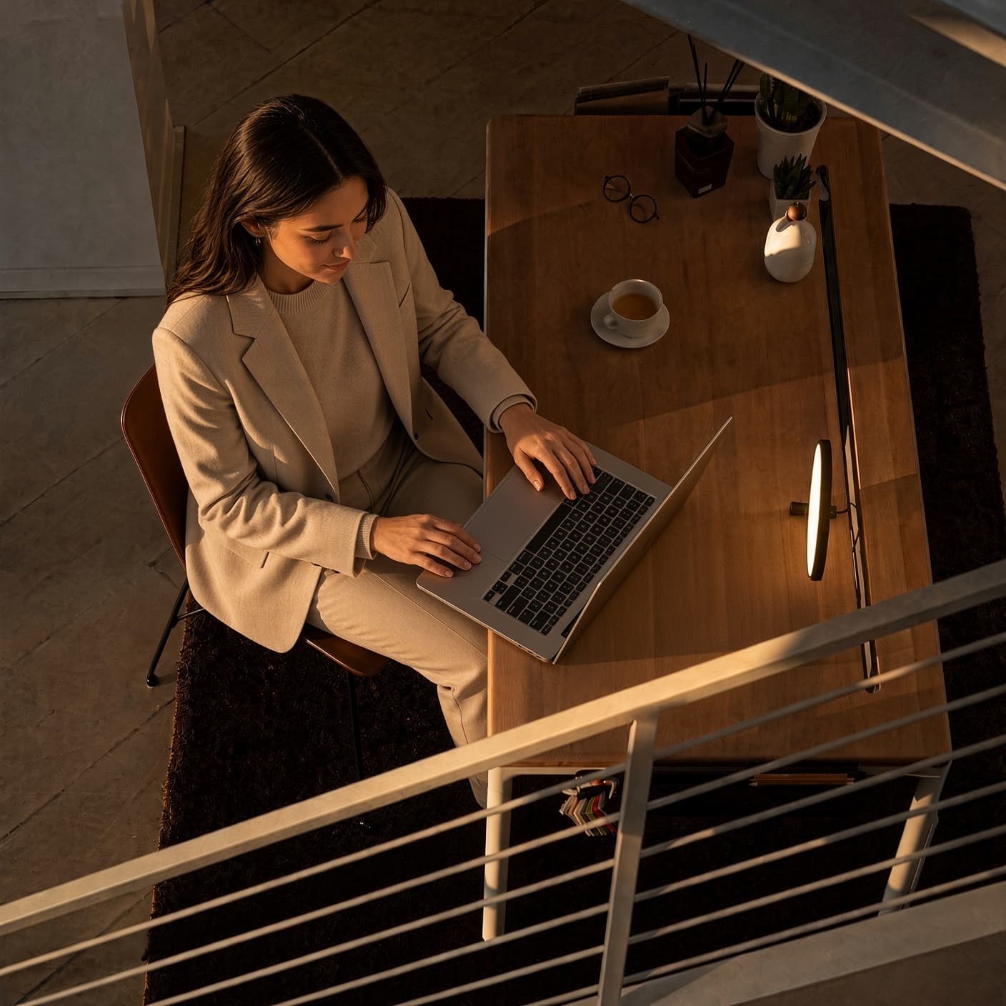 Support staff preparing a document on a laptop